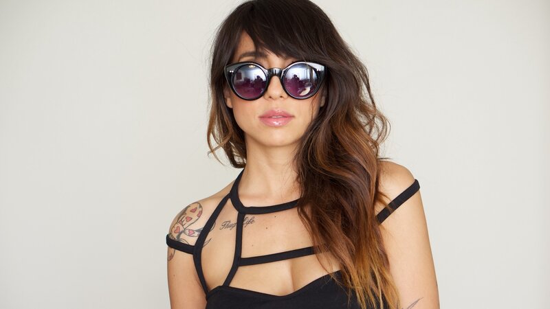 woman with sunglasses and tattoos
