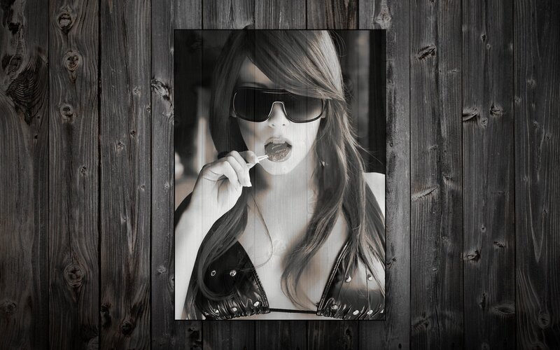 woman with sunglasses eating lollipop