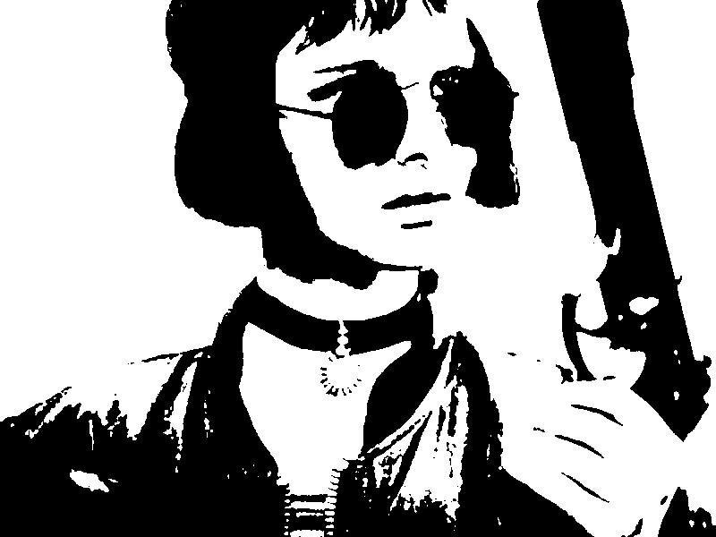 woman with sunglasses holding gun