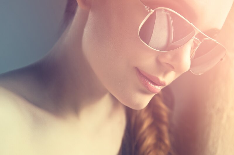woman with sunglasses in sunlight
