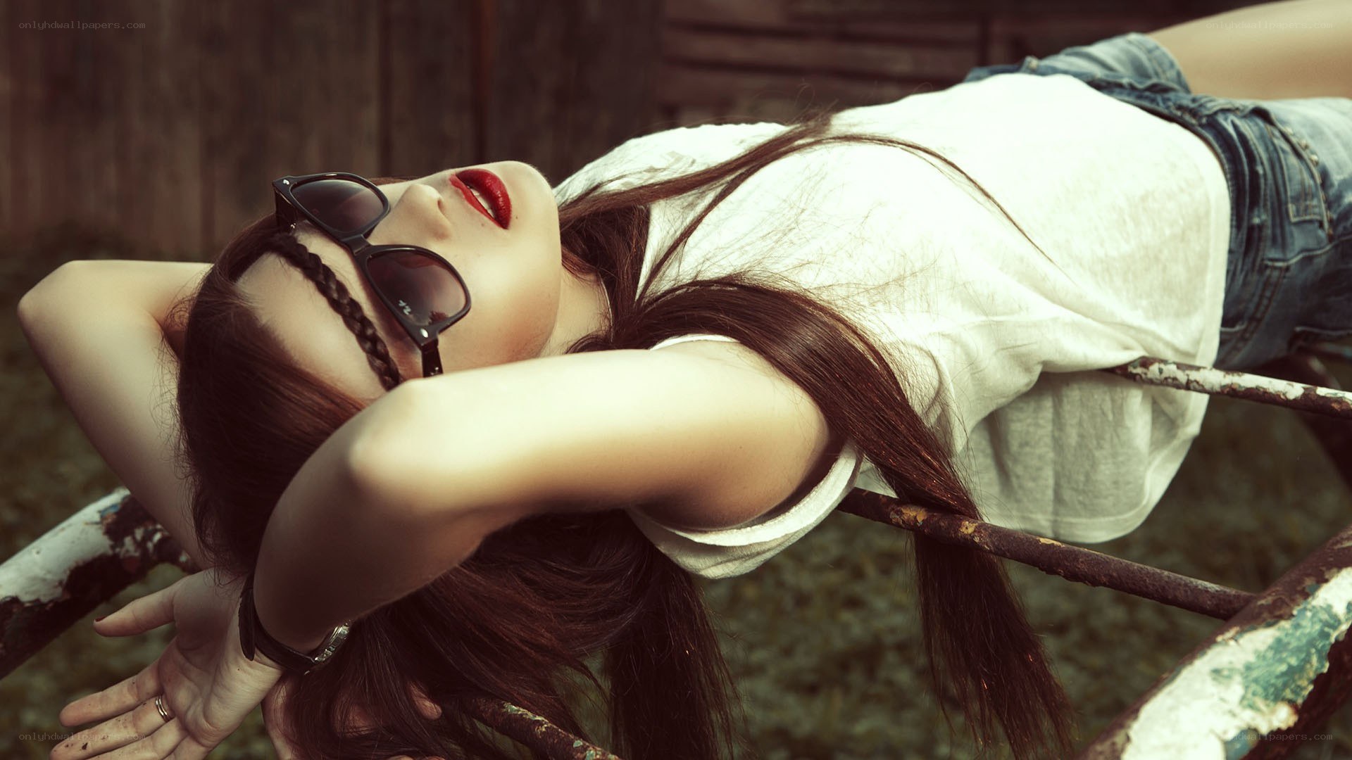 woman with sunglasses lying down