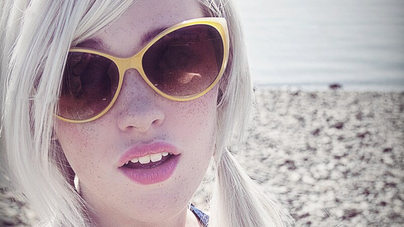woman with sunglasses on beach