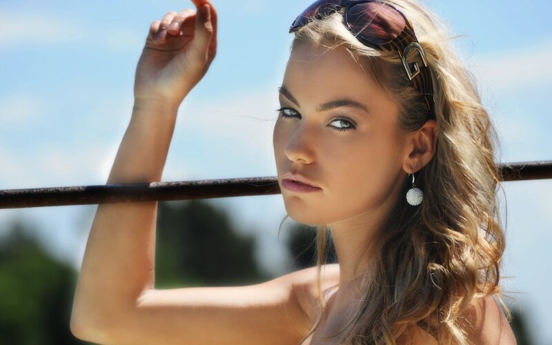 woman with sunglasses on head