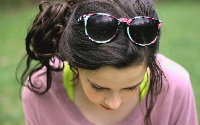 woman with sunglasses on head