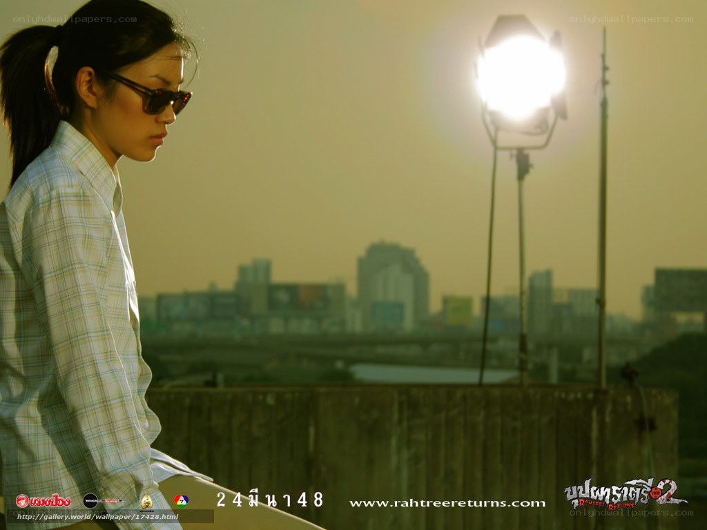 woman with sunglasses on rooftop