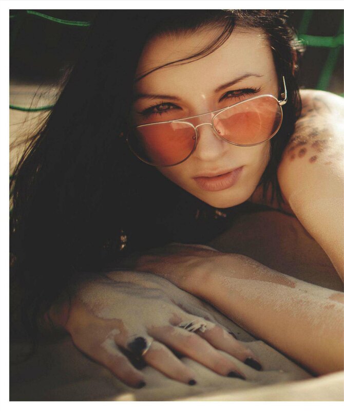 woman with sunglasses on sand