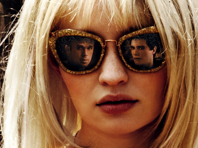 woman with sunglasses reflecting men