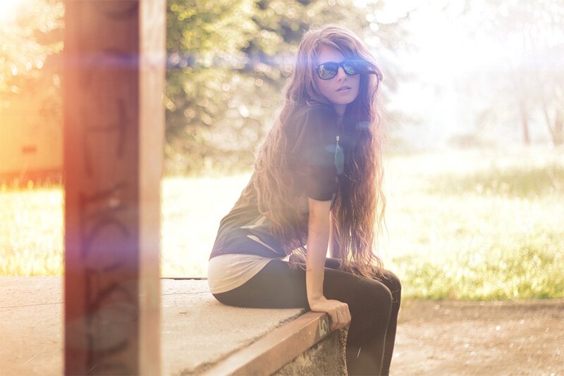 woman with sunglasses sitting outside
