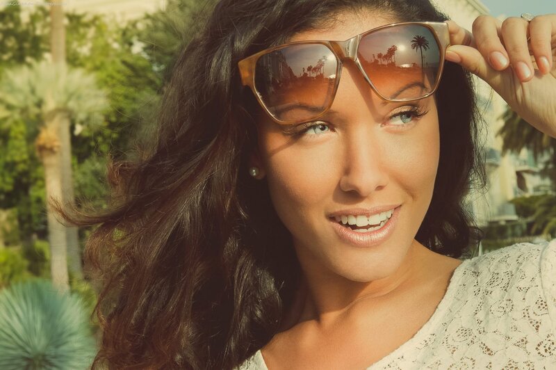 woman with sunglasses smiling