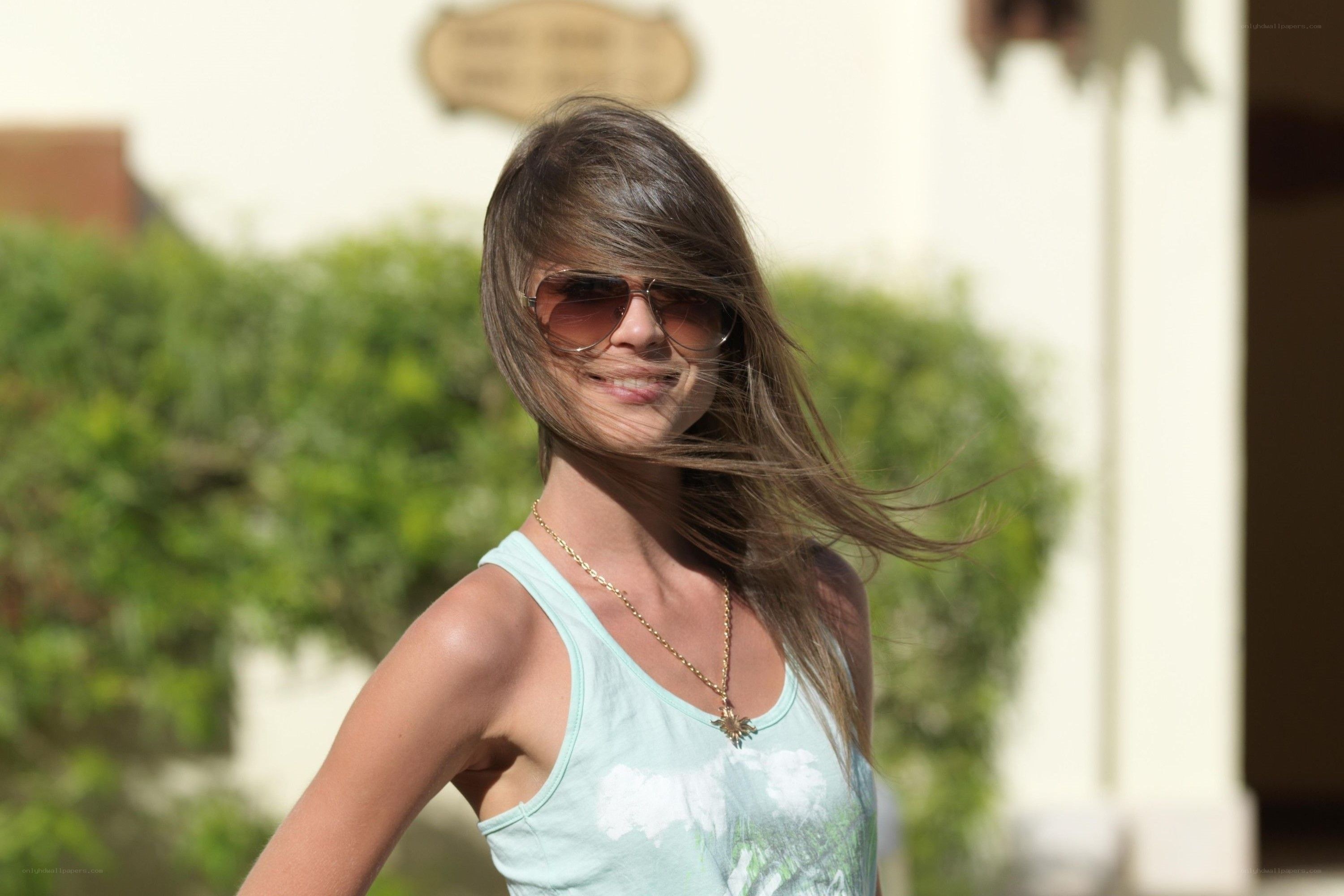 woman with sunglasses smiling
