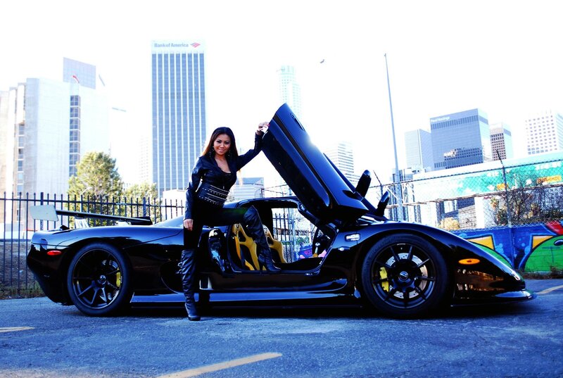 woman with supercar in city