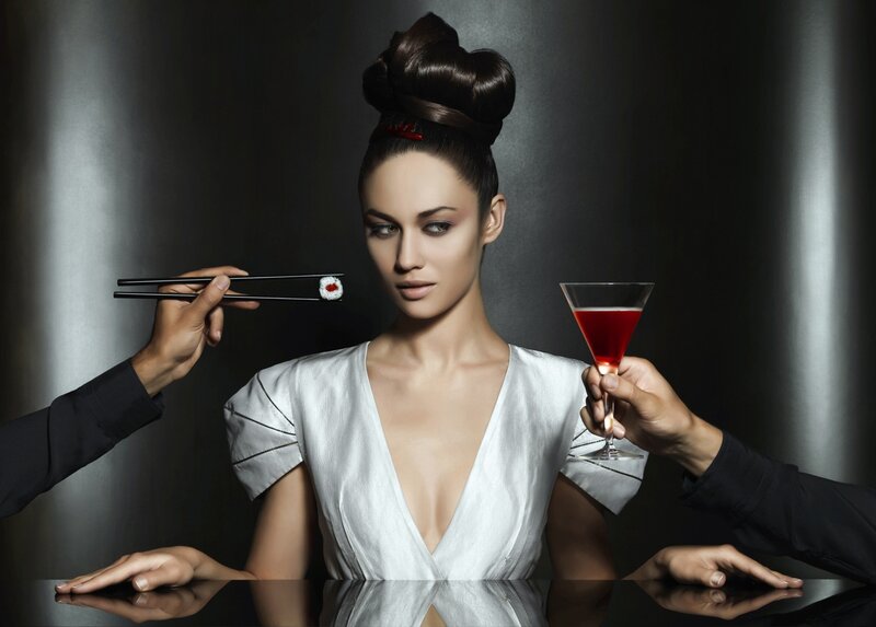 Woman with sushi and cocktail