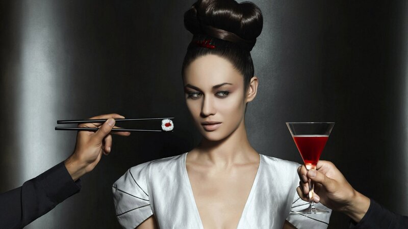 woman with sushi and cocktail