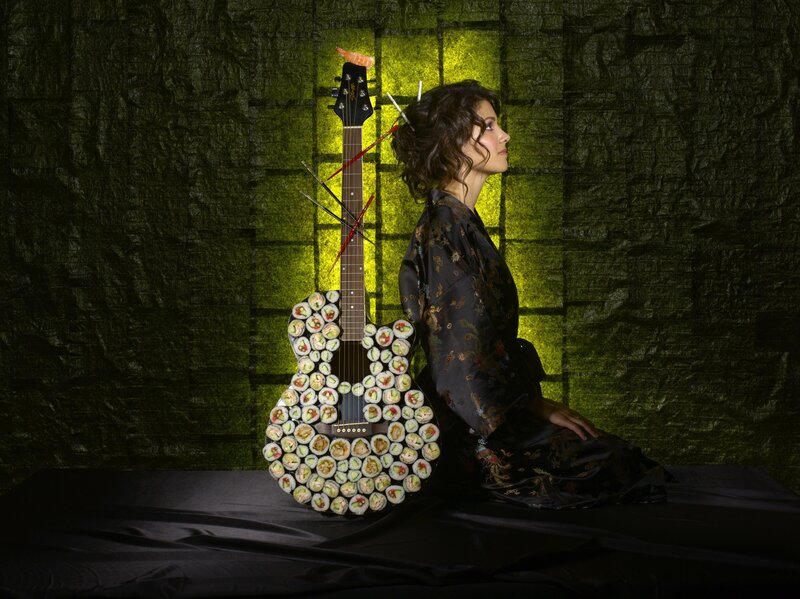 woman with sushi guitar
