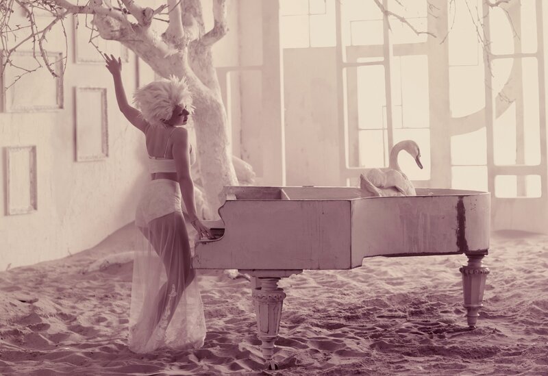woman with swan on piano
