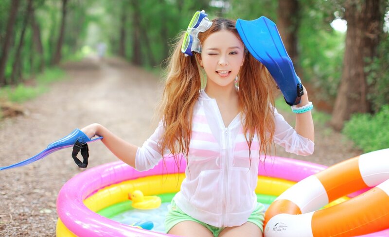woman with swim gear in inflatable pool