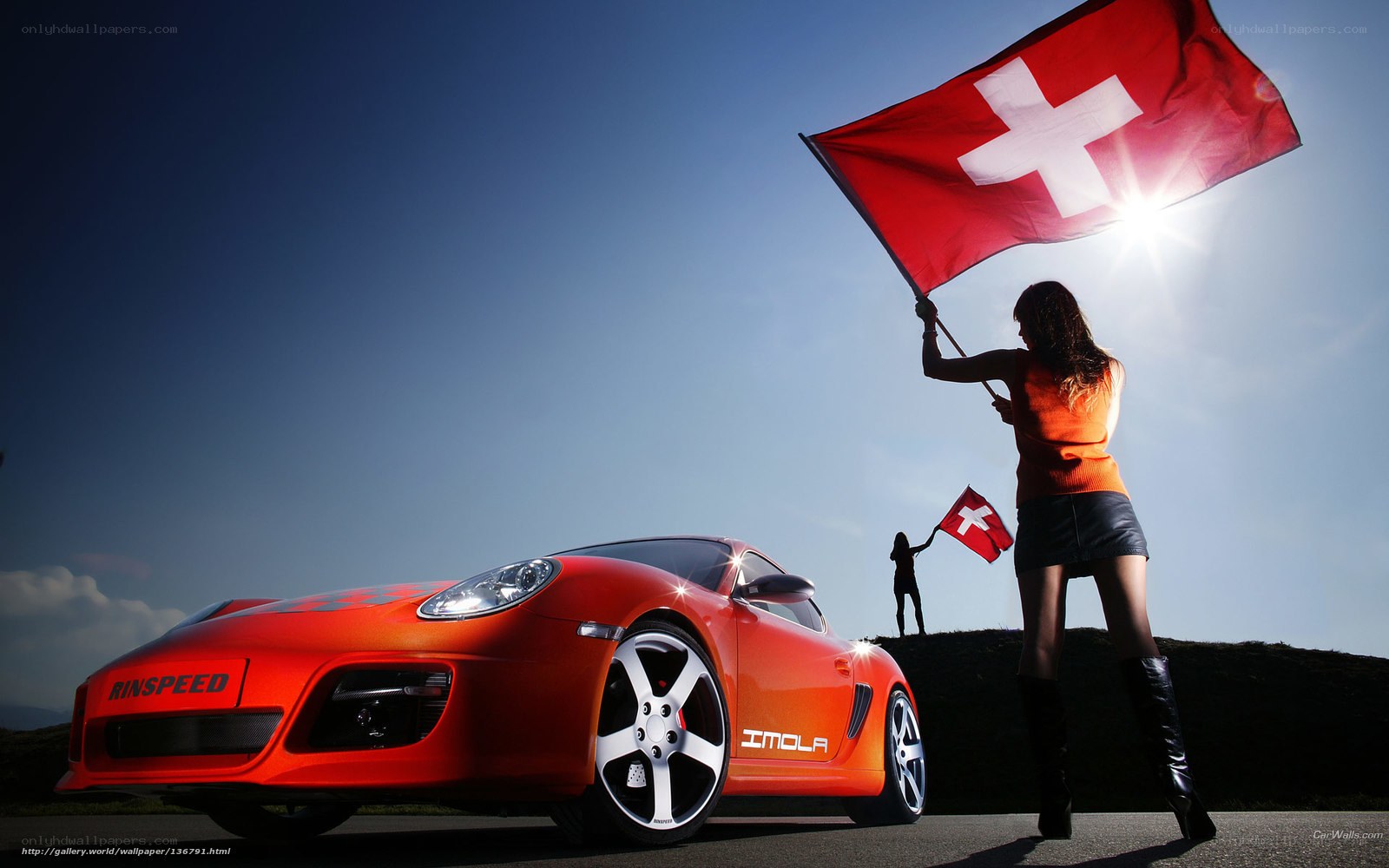 Woman with Swiss flag and red car