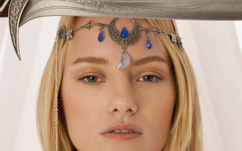 woman with sword and headpiece