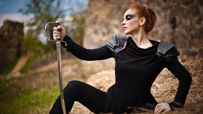 woman with sword in black outfit