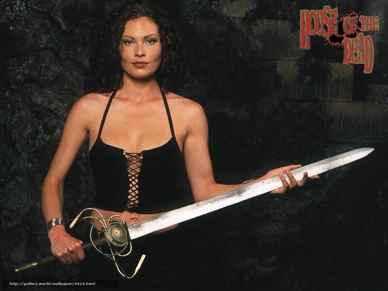 Woman with sword in dark setting