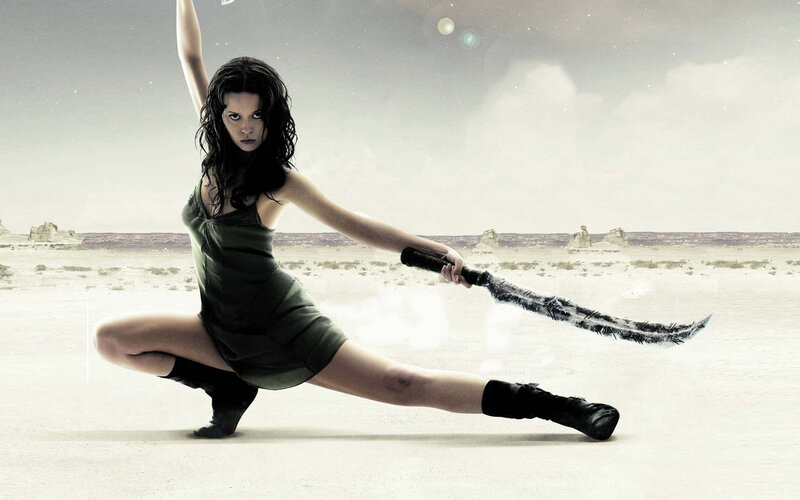 woman with sword in desert