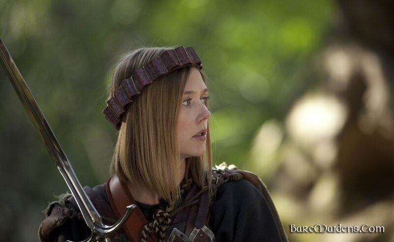 woman with sword in forest