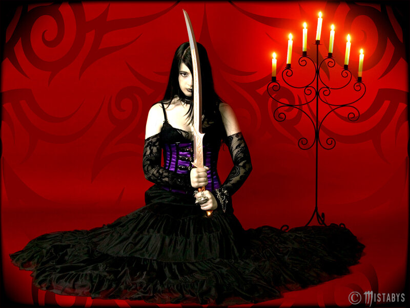 Woman with sword in gothic dress