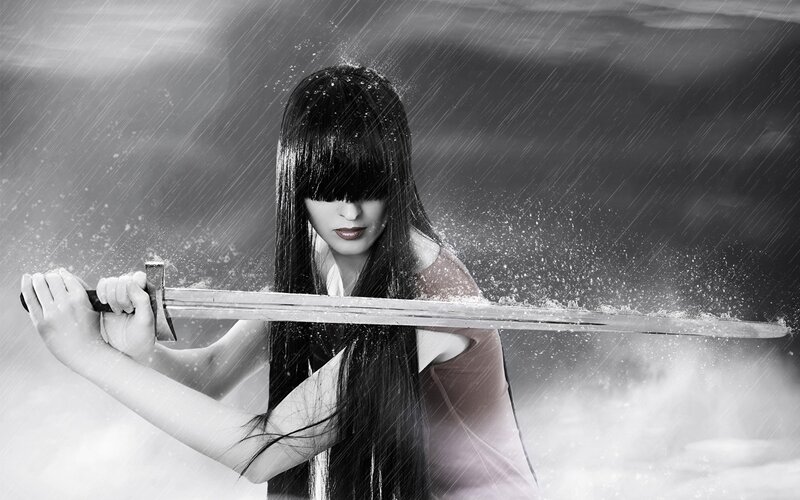 Woman with sword in rain