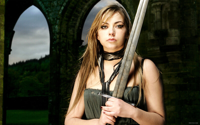 woman with sword in ruins