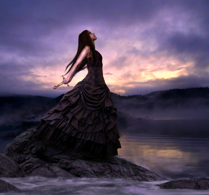 woman with sword on rock