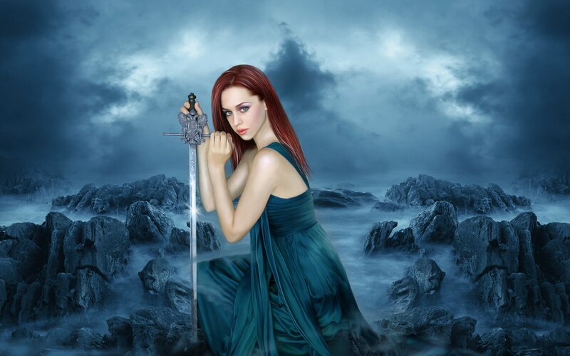 Woman with sword on rocky shore