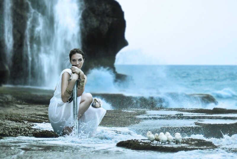Woman with Sword on Shore — Blue