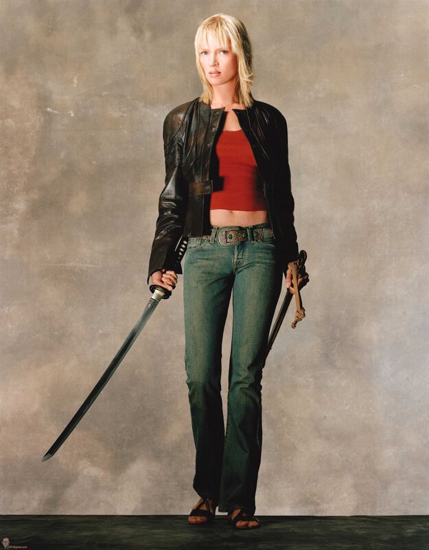 Woman with swords in studio