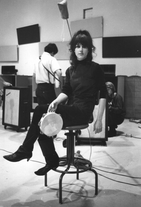 Woman with tambourine in studio