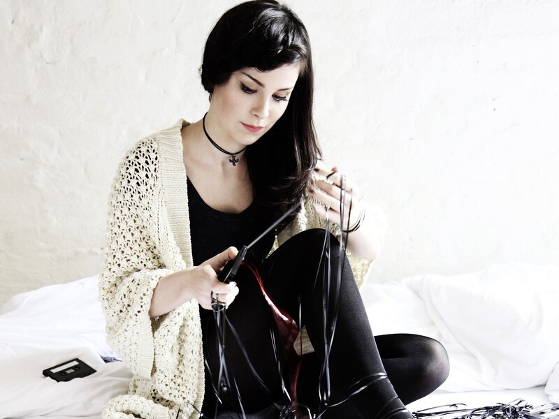 woman with tape and headphones