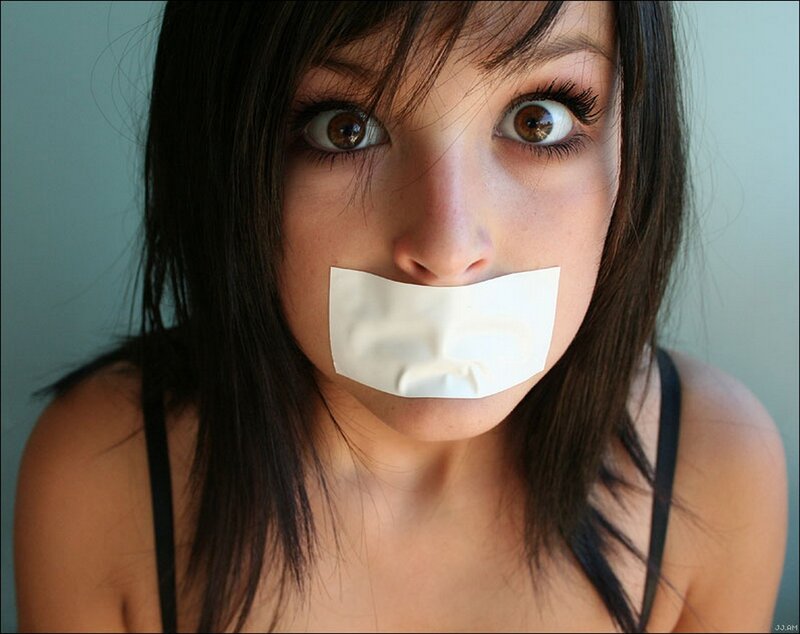 woman with tape over mouth