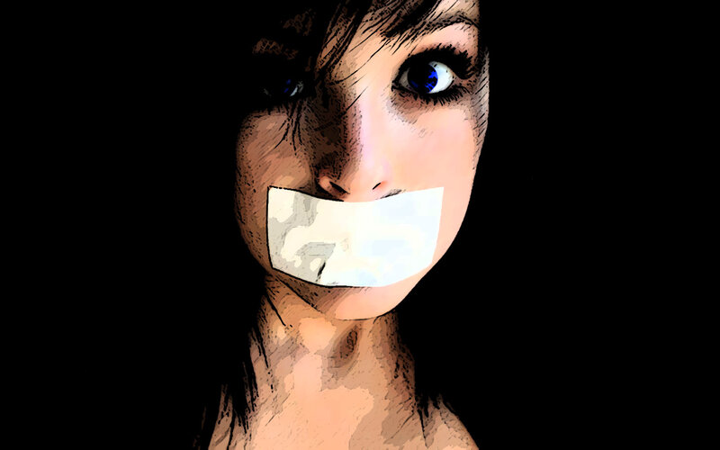 woman with tape over mouth