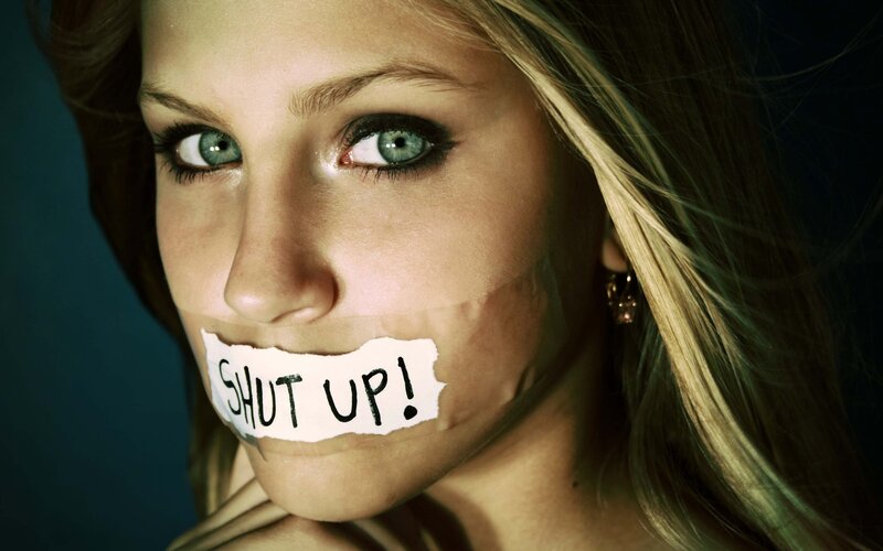 Woman with tape over mouth