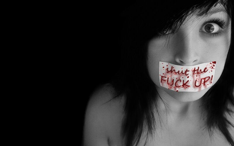 woman with tape over mouth