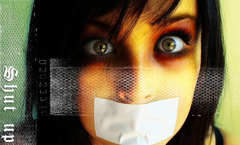 woman with tape over mouth