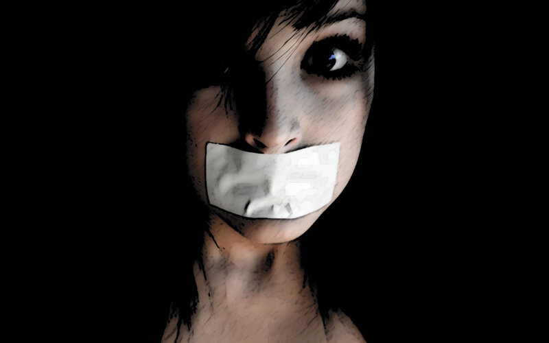 woman with tape over mouth