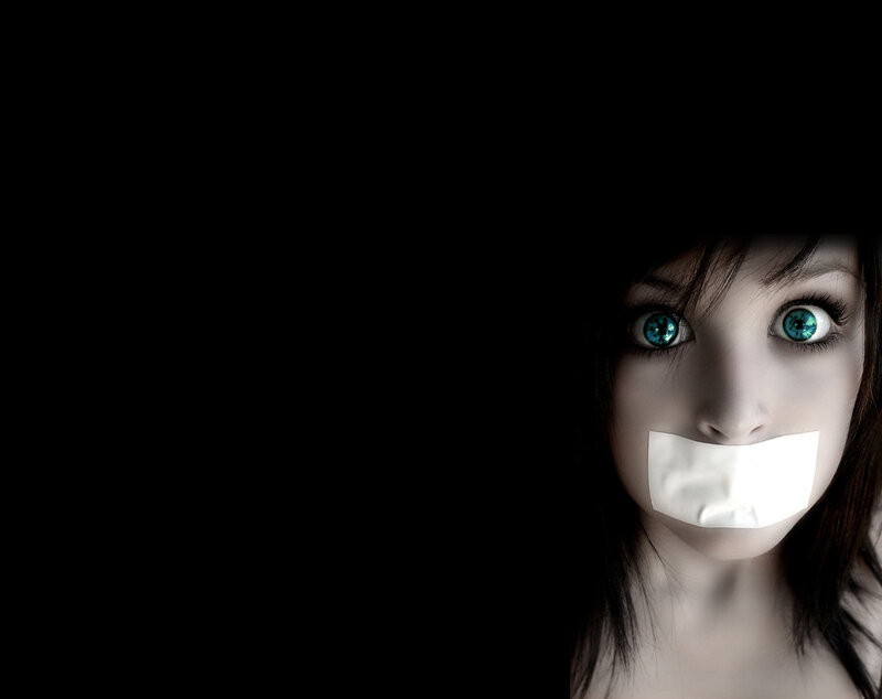 woman with tape over mouth