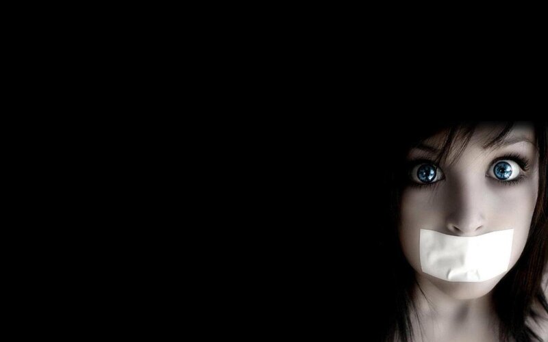 woman with tape over mouth