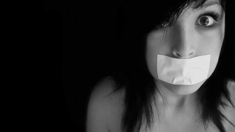 Woman with Tape over Mouth — Black, Dramatic, Photograph