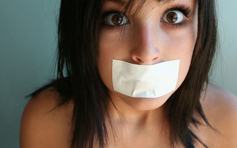 Woman with Tape over Mouth — Brown, Dramatic