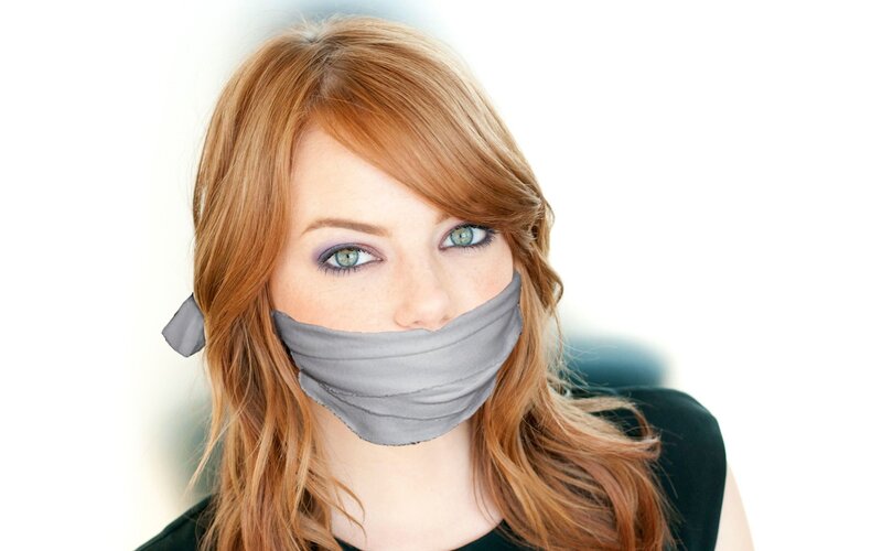 woman with tape over mouth