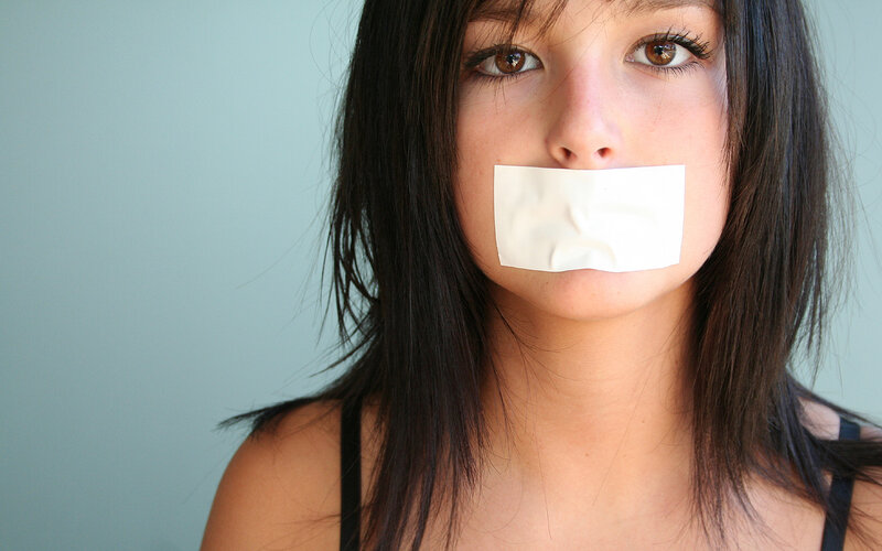 Woman with Tape over Mouth — White, Dramatic