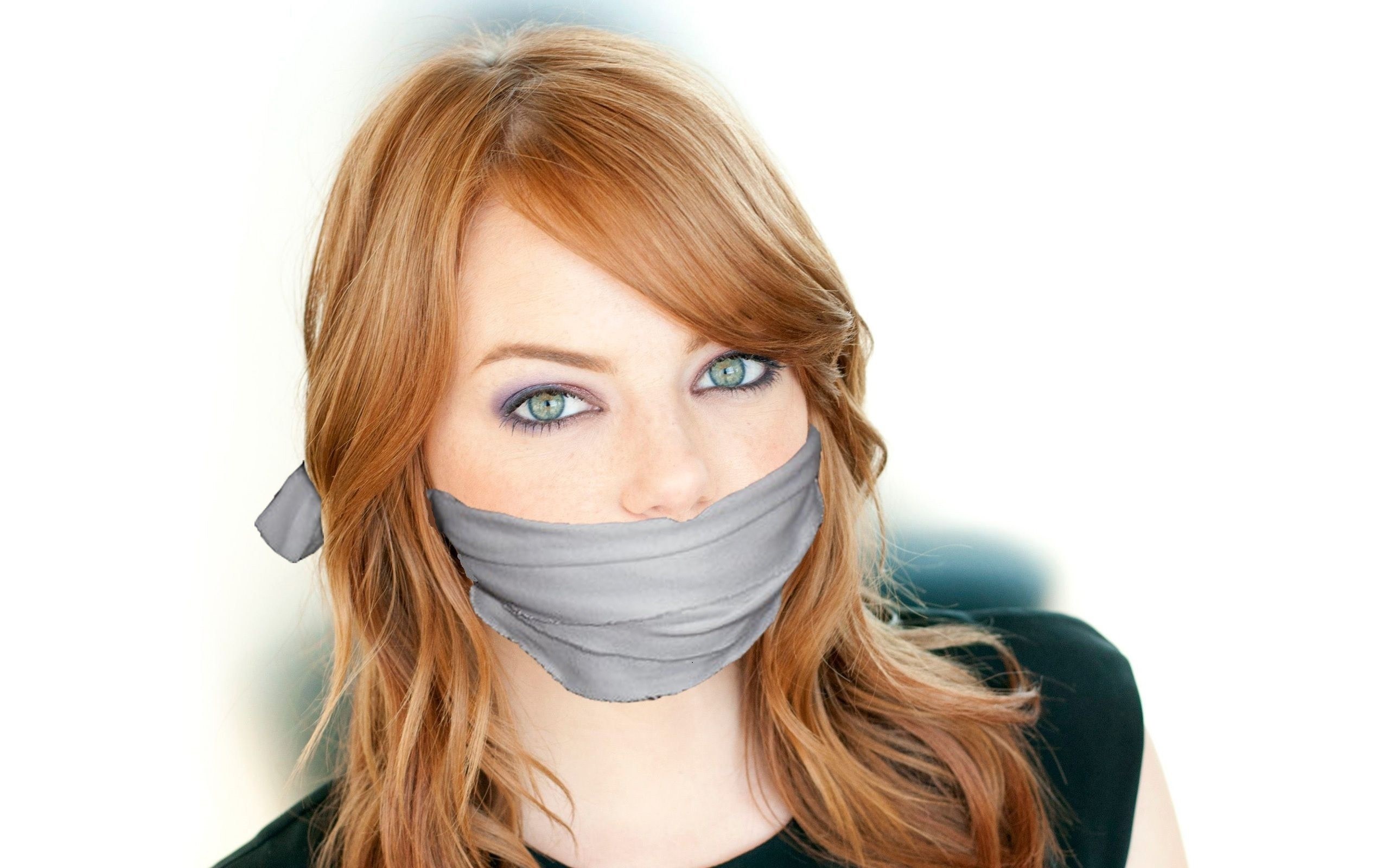 woman with tape over mouth