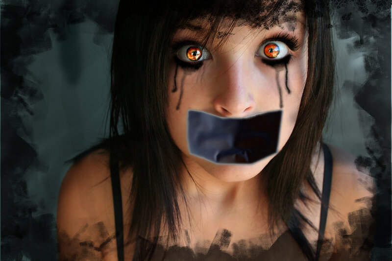 woman with taped mouth