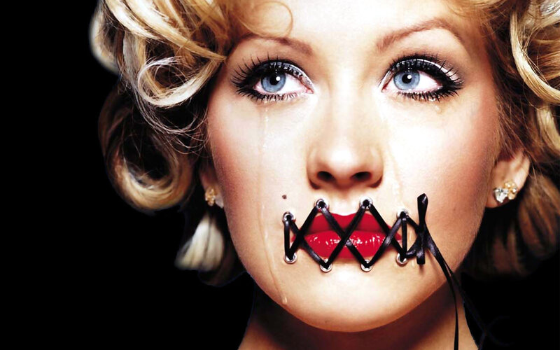 woman with taped mouth
